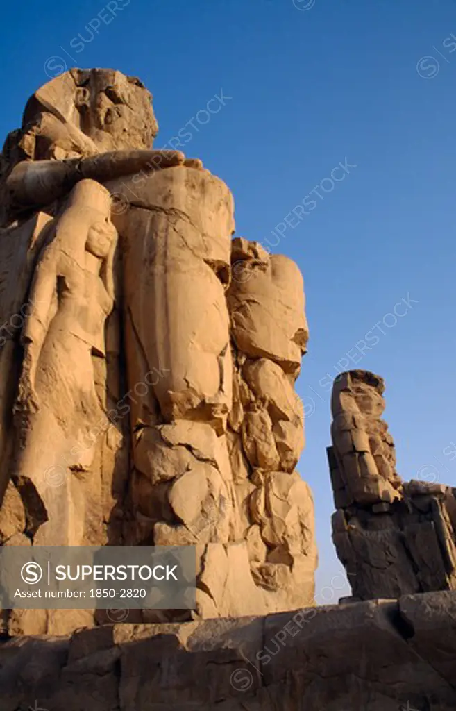 Egypt, Thebes, The Colossi Of Memnon The Only Remains Of The Mortuary Temple Of  Amenophis Iii