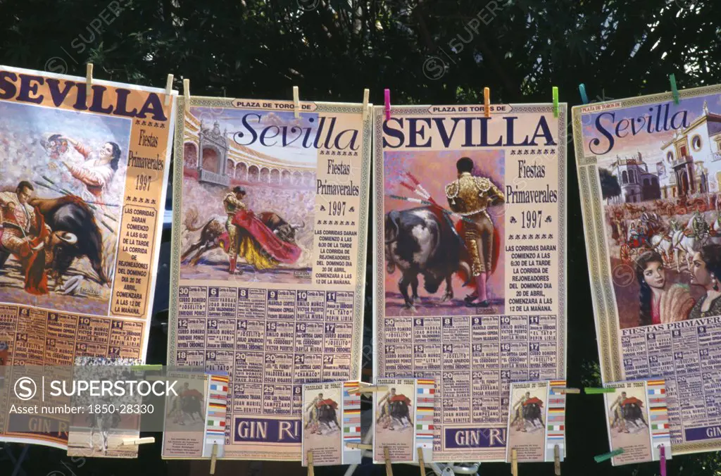 Spain, Andalucia, Seville, Posters And Tickets For A Bullfight Hanging From A Line Outside The Bullring In Arenal District.