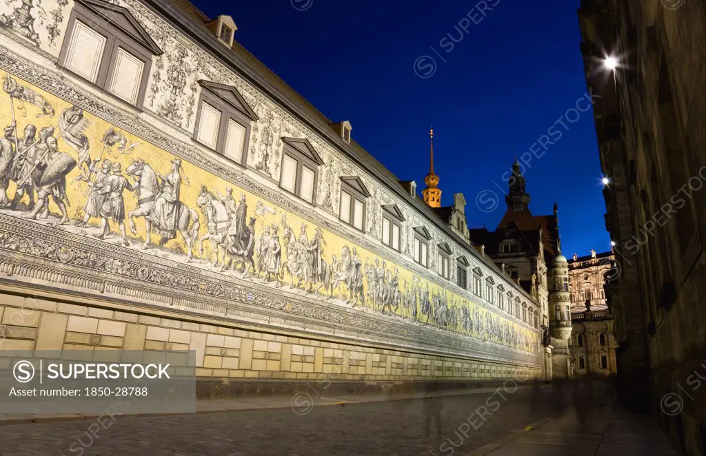 Germany, Saxony, Dresden, Furstenzug Or Procession Of The Dukes Illuminated At Sunset In Auguststrasse A Mural On 25 000 Meissen Tiles That Depicts 35 Noblemen From The 12Th Century Konrad The Great  To Friedrich August Iii  Saxonys Last King  Who Ruled From 1904-1918. It Was Originally Painted By Wilhelm Walter Between 1870 And 1876 But Eventually  The Stucco Began To Crumble And Around 1906-07 It Was Replaced By The Tiles.