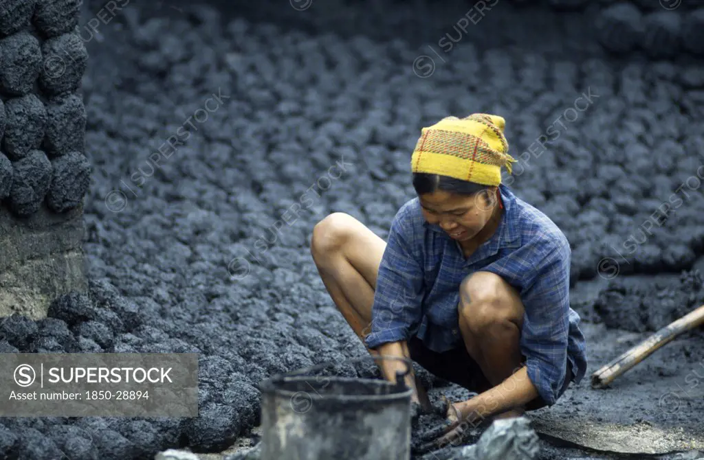 Vietnam, North, Environment, Woman Making Cakes Of Dried Coal Dust To Fuel Kiln.