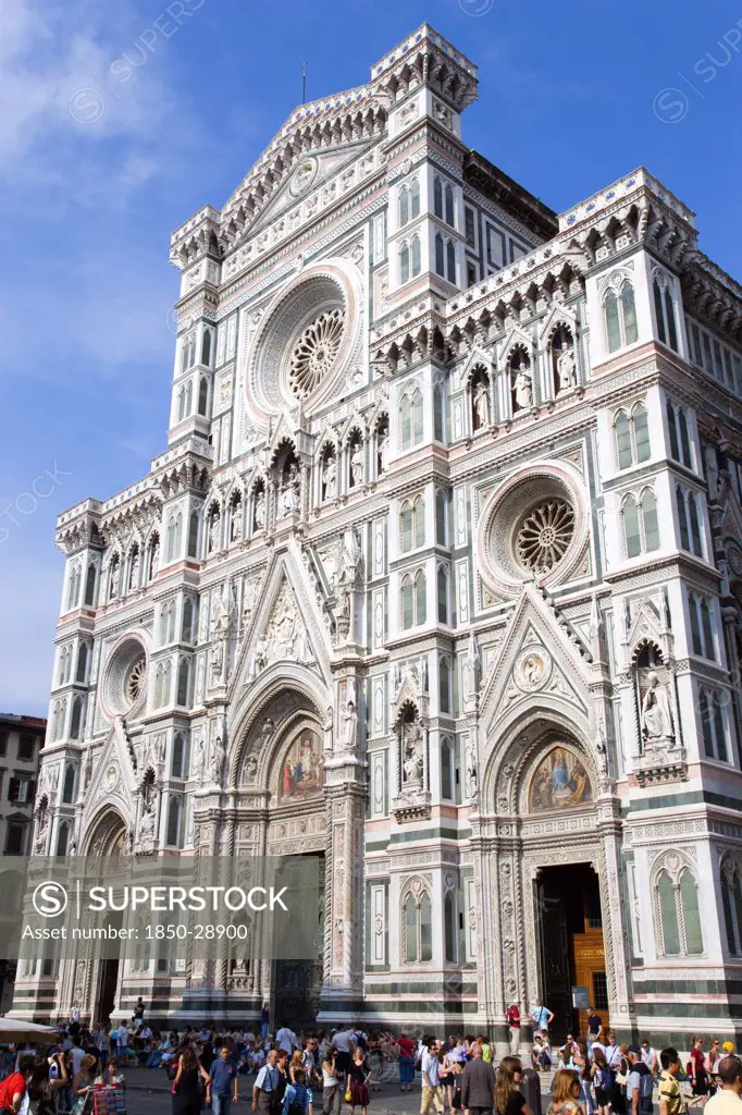 Italy, Tuscany, Florence, Tourists In Front Of The Neo-Gothic Marble West Facade Of The Cathedral Of Santa Maria Del Fiore  The Duomo.