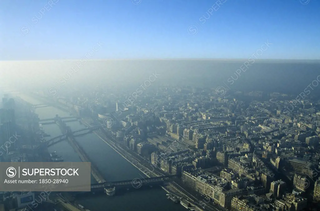 France, Ile De France, Paris, Aerial View Over City Through Thick Smog.