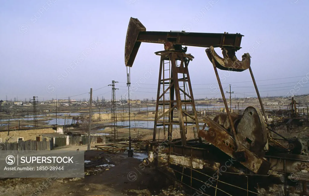 Azerbaijan, Pollution, Polluted Wasteland With Nodding Donkey Of Oil Field Near Baku.