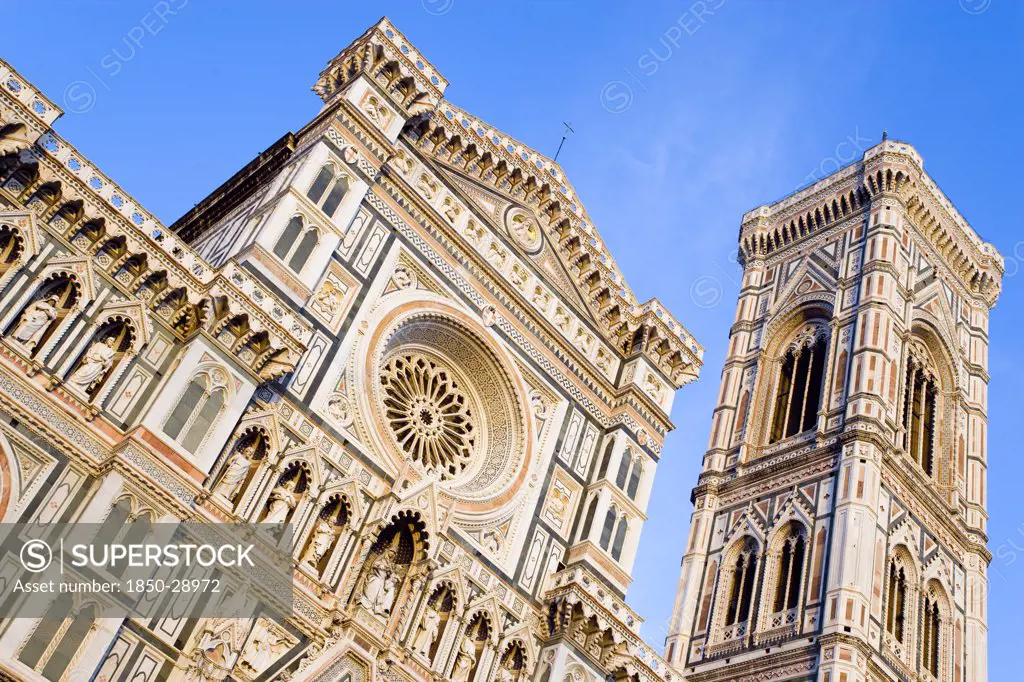 Italy, Tuscany, Florence, The Neo-Gothic Marble West Facade Of The Cathedral Of Santa Maria Del Fiore  The Duomo  And Giottos Campanile Bell Tower At Sunset.