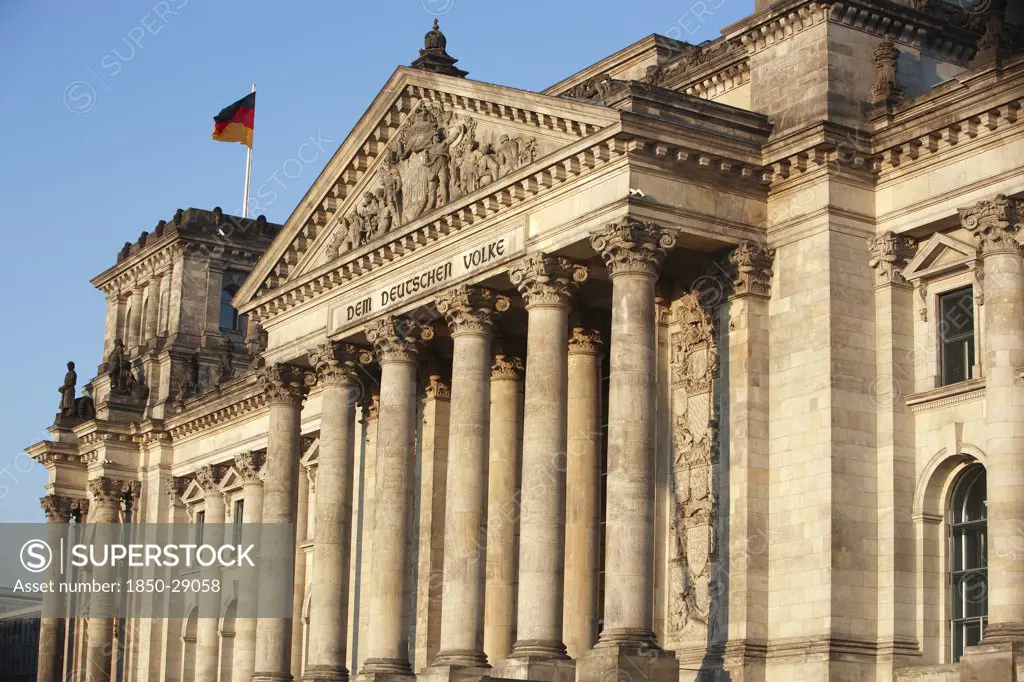 Germany, Berlin, The Reichstag  Seat Of The German Parliament.  Colonnaded Exterior Facade Designed By Paul Wallot 1884-1894 With Inscription In German Dem Deutschen Volke,To The German People .