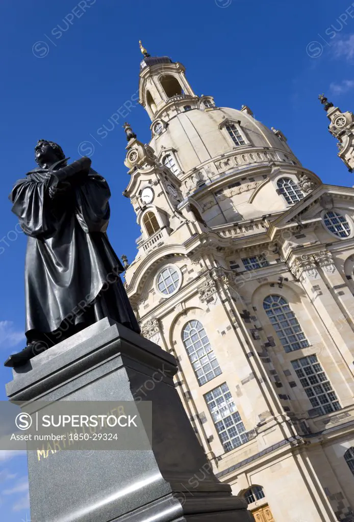 Germany, Saxony, Dresden, The Restored Baroque Church Of Frauenkirch Church Of Our Lady In Neumarkt Square With A Statue Of Martin Luther In The Foreground.
