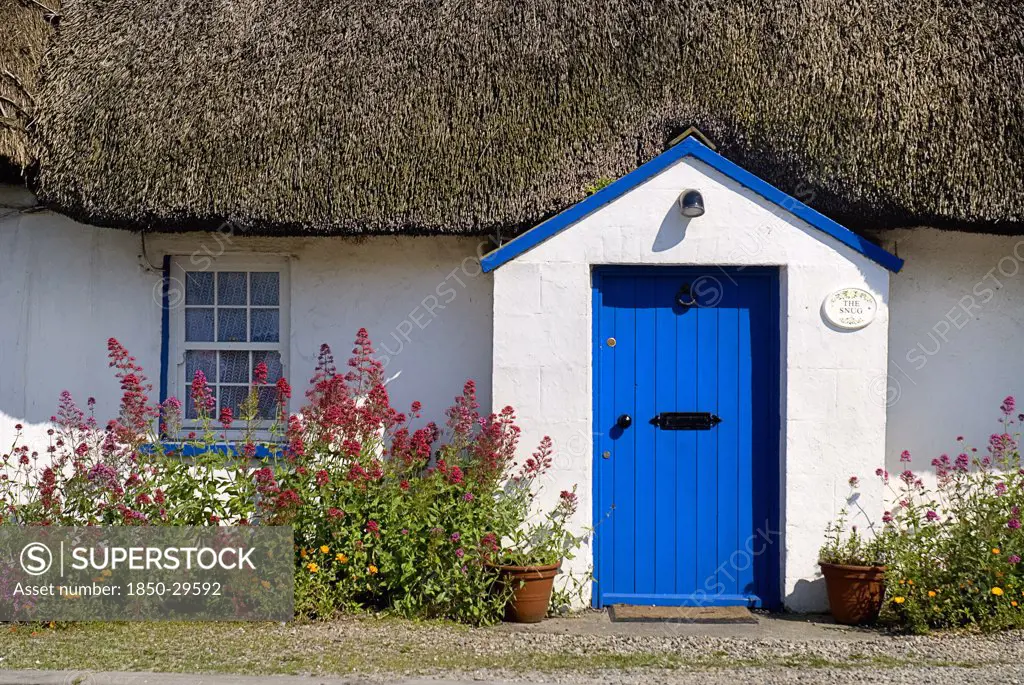 Ireland, County Wexford, Kilmore Quay, Thatched Cottage In Fishing Village Renowned For Such Dwellings  FaAde And Flowers
