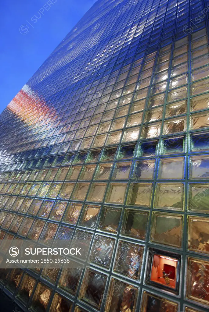 Japan, Honshu, Tokyo, Ginza  Nightime View Of The Glass Block Facade Of The Hermes Building.