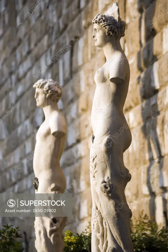 Italy, Tuscany, Florence, Armless Male And Female Statues Outside The Palazzo Vecchio In The Piazza Della Signoria.