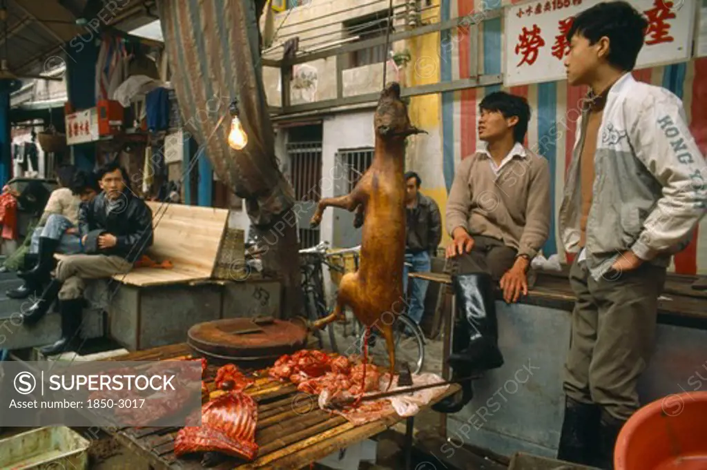 China, Guangdong Province, Guangzhou , Dog Meat For Sale On Street Stall.