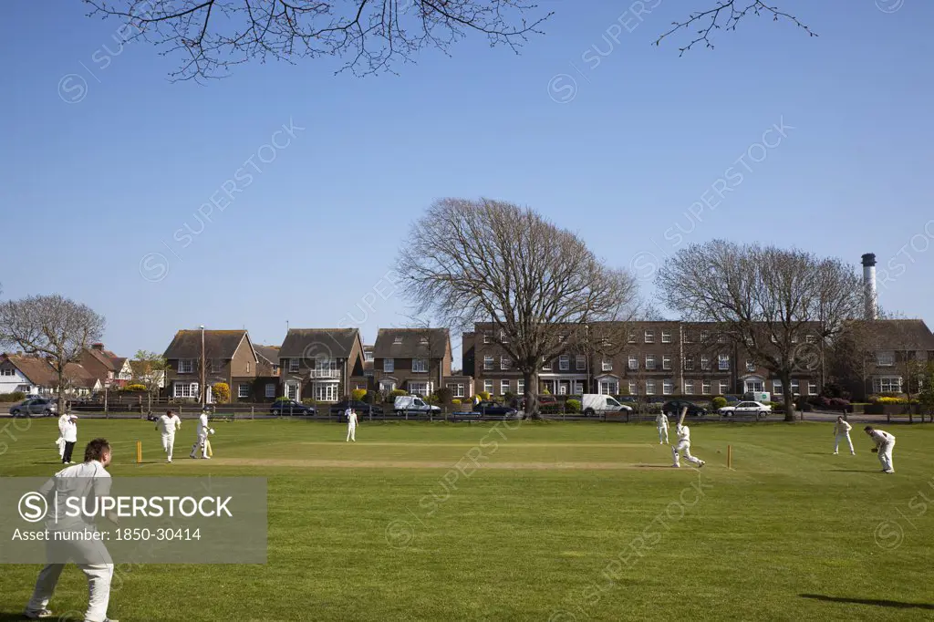 England, West Sussex, Southwick, Local Cricket Team Playing On Village Green.