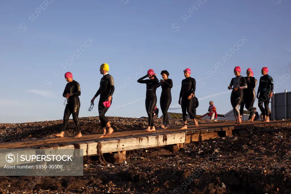 England, West Sussex, Goring-By-Sea, Worthing Triathlon 2009  Female Competitors Making Their Way Down Slipway To Swim Starting Point.