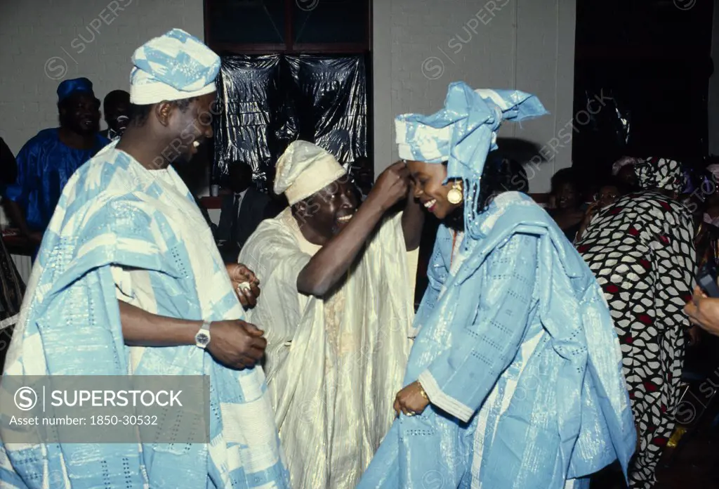 Nigeria Religion Weddings, Bride and Groom at traditional wedding  dressed in traditional clothing