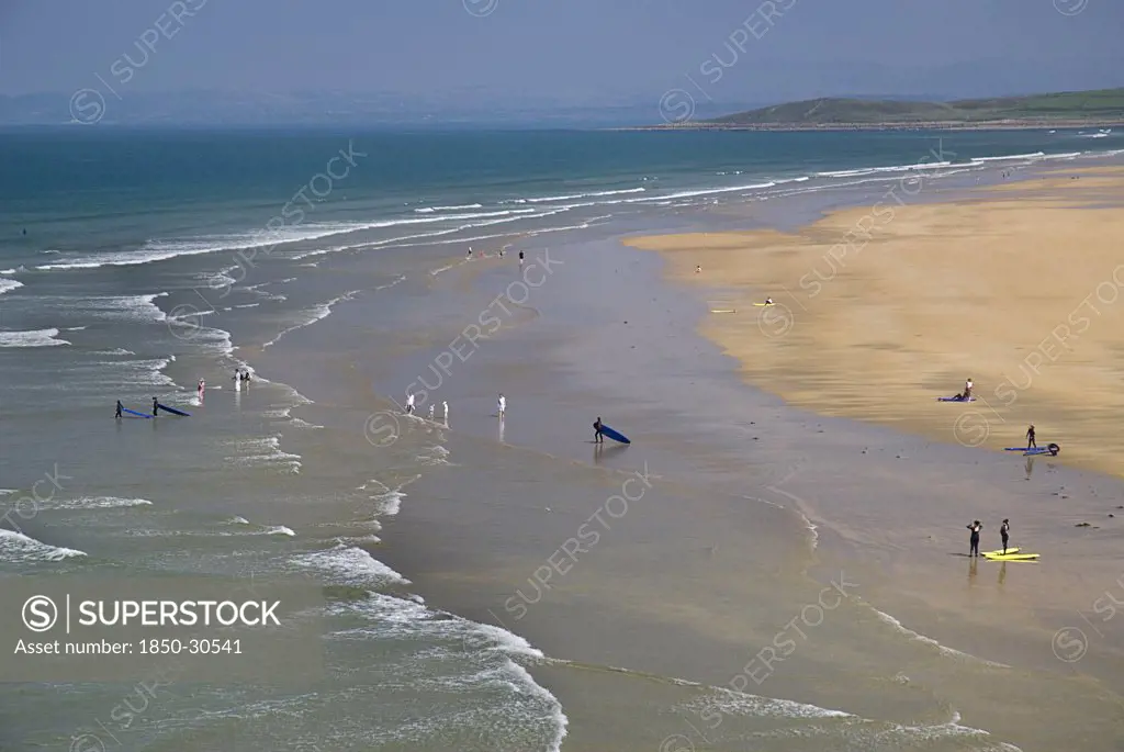 Ireland County Donegal Bundoran, Tullan Strand beach with surfers