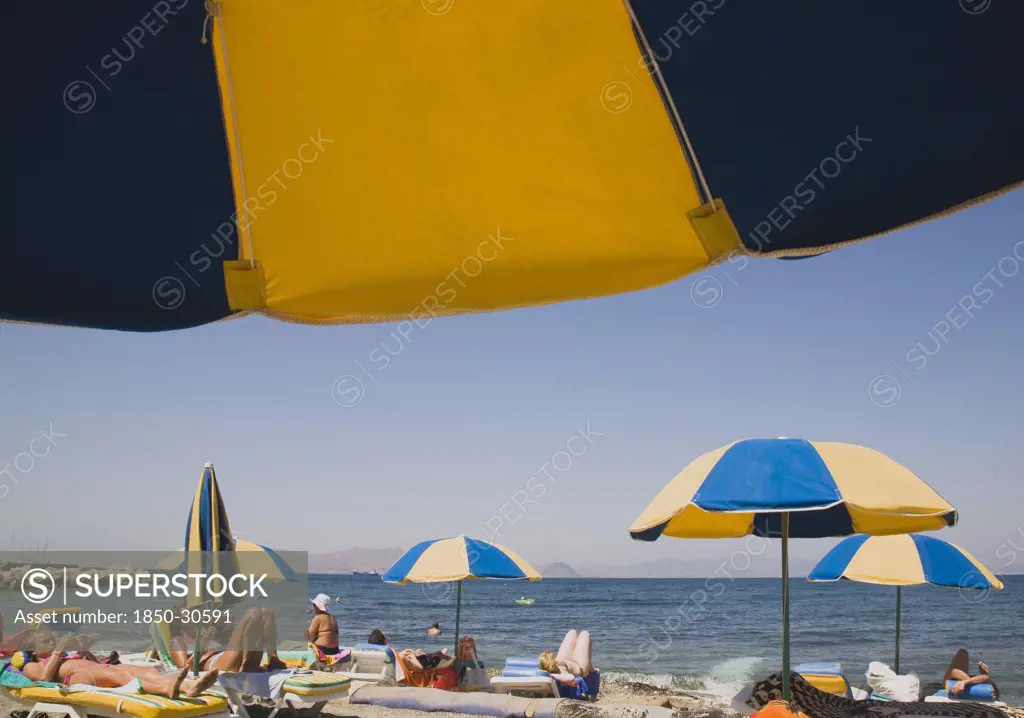 Greece Dodecanese Islands Kos, Sunbathers on loungers