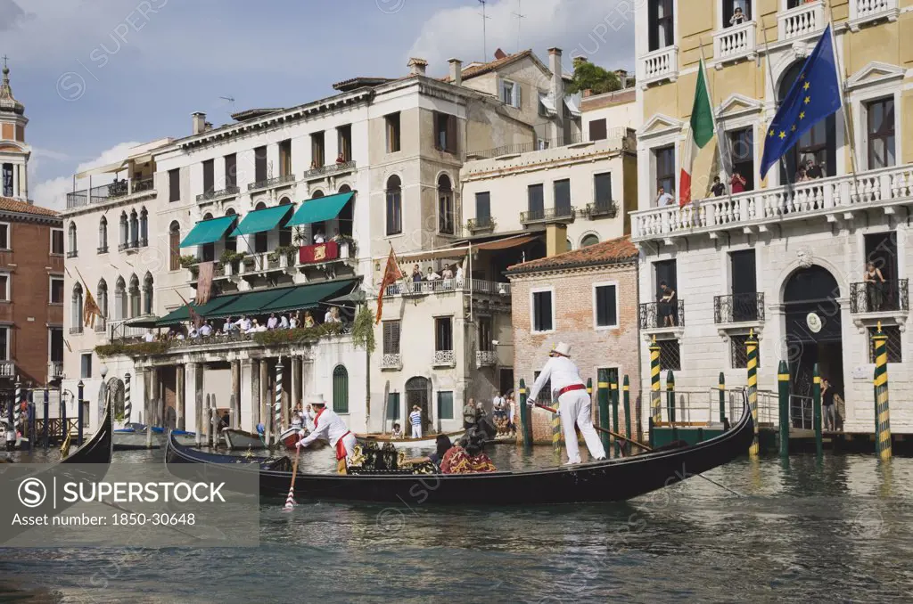 Italy Veneto Venice, Participants in the Regatta Storico historical annual regatta wearing traditional costume rowing