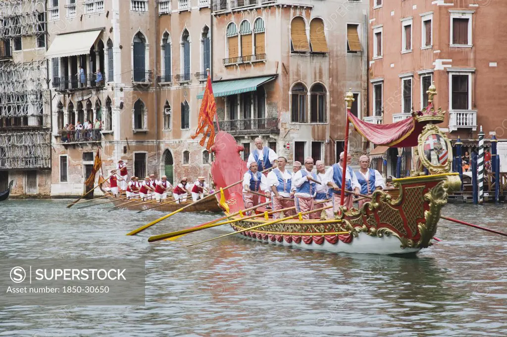 Italy Veneto Venice, Participants in the Regatta Storico historical annual regatta wearing traditional costume rowing