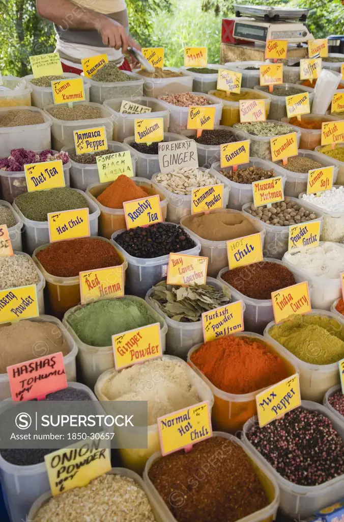 Turkey Aydin Province KUSAdasi, Stall at weekly market selling spices and chili powders in brightly coloured display