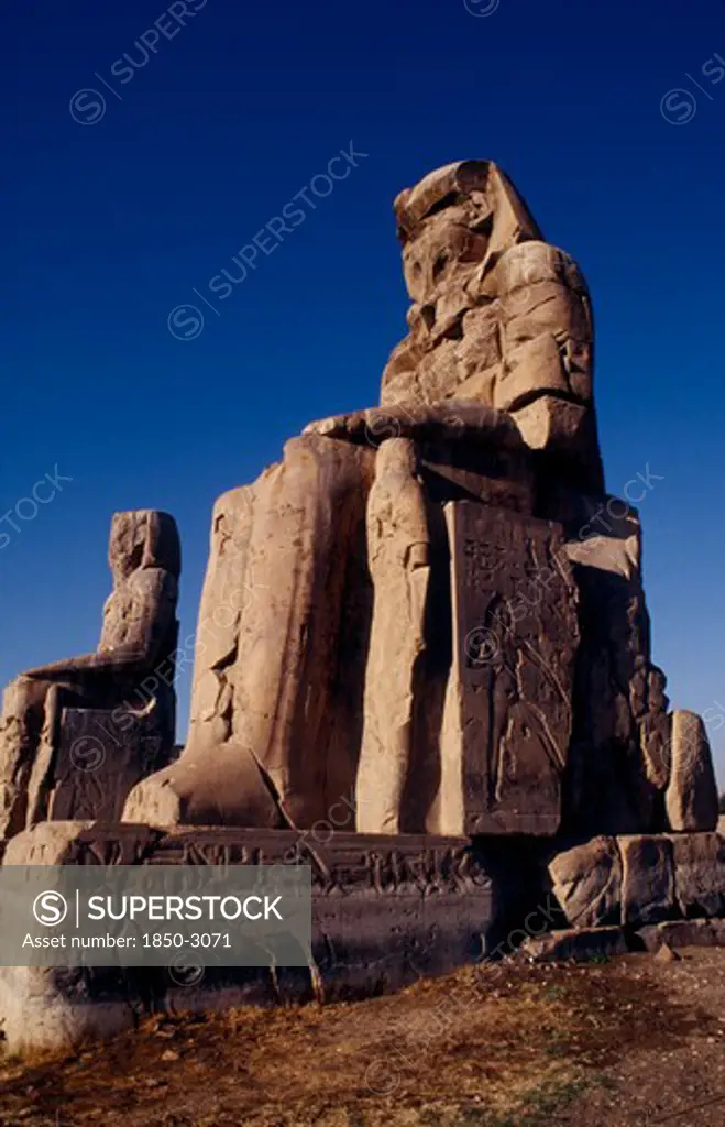 Egypt, Thebes, The Colossi Of Memnon. The Only Remains Of The Mortuary Temple Of Amenophis Iii