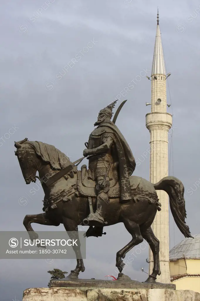 Albania Tirana, Statue of Skanderbeg  the national hero  with the Ethem Bey mosque in the background