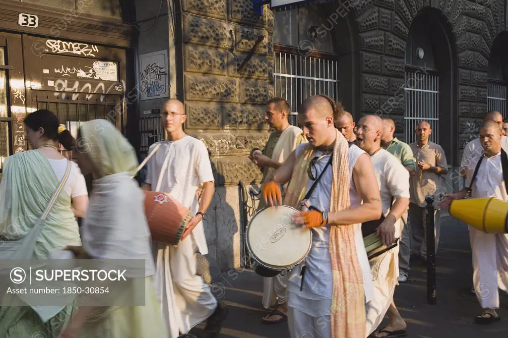 Hungary Pest County Budapest, Hare Krishna devotees singing and dancing on Andrassy UtIn Pest