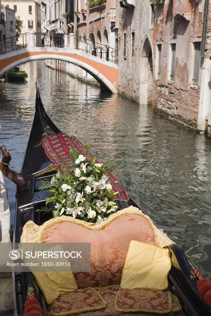 Italy Veneto Venice, Gondola prepared for wedding with flowers