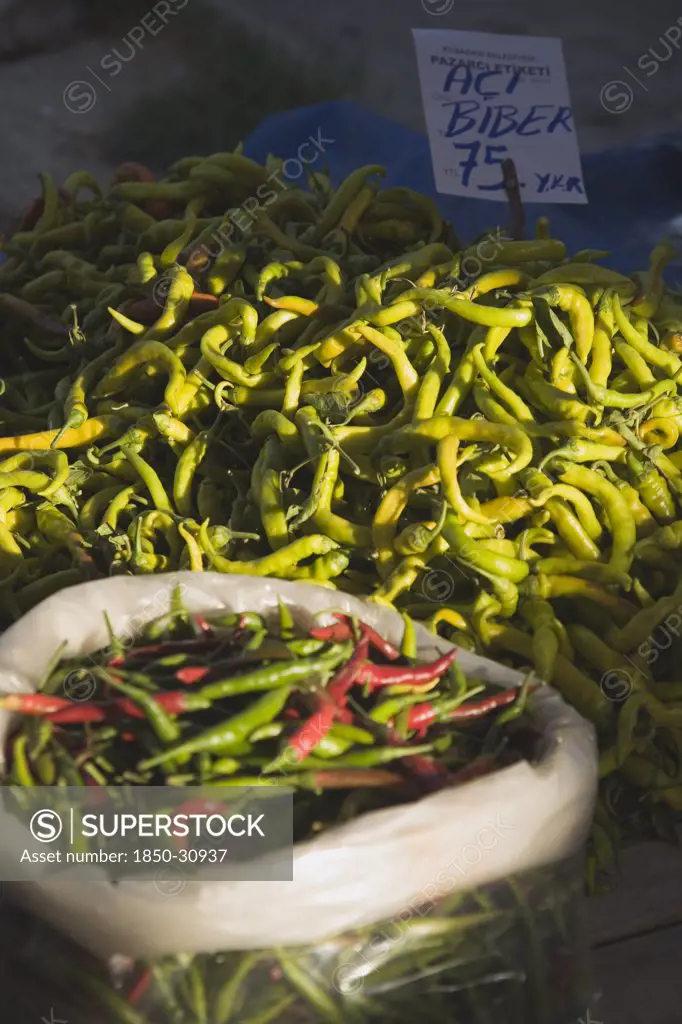 Turkey Aydin Province KUSAdasi, Red and green chilies for sale on stall at weekly market