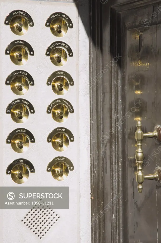 Italy Veneto Venice, Brass doorbells with nameplates on restored façade