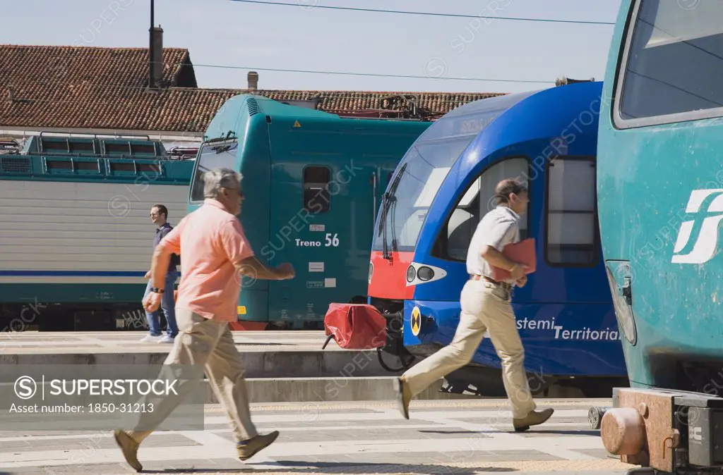 Italy Veneto Venice, Commuters running to board local train
