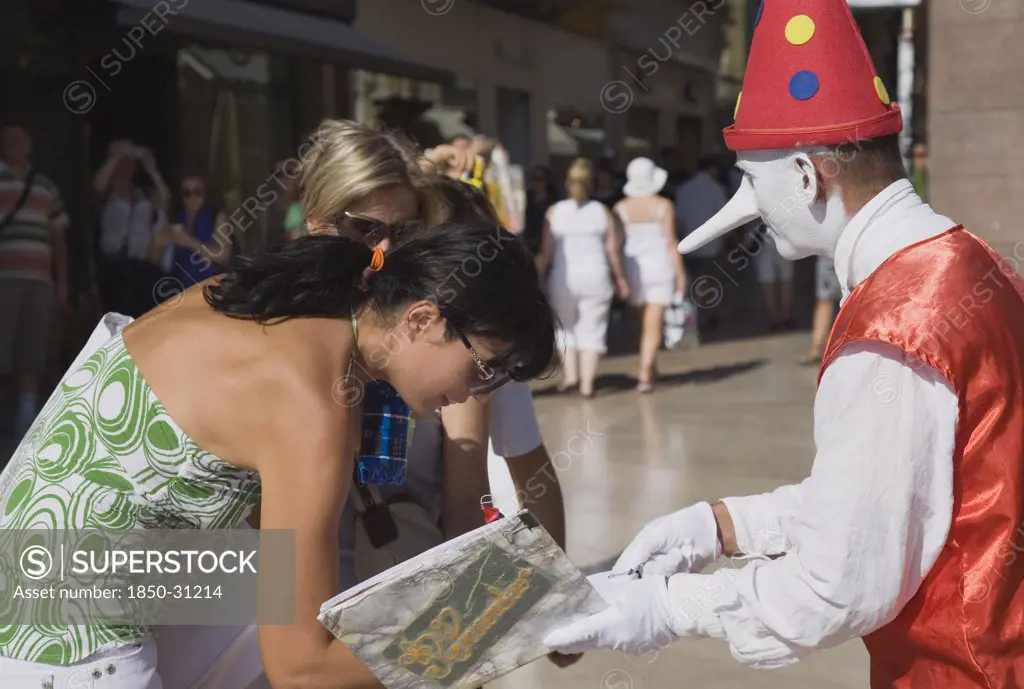 Italy Veneto Verona, Street performer dressed in clown costume