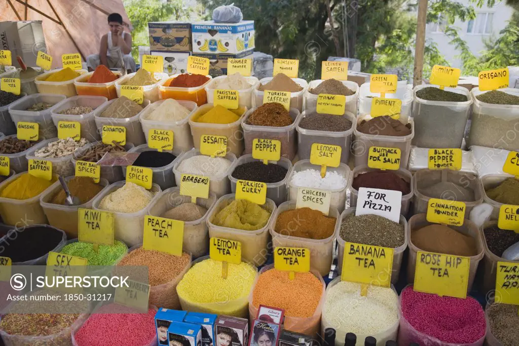 Turkey Aydin Province KUSAdasi, Stall at weekly market selling spices and tea powders in brightly coloured display