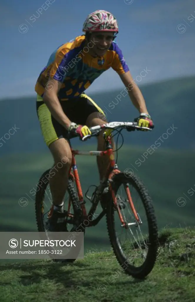 Sport, Cycling , Mountain Biking, Young Man On Muddy Mountain Bike In The Lake District.