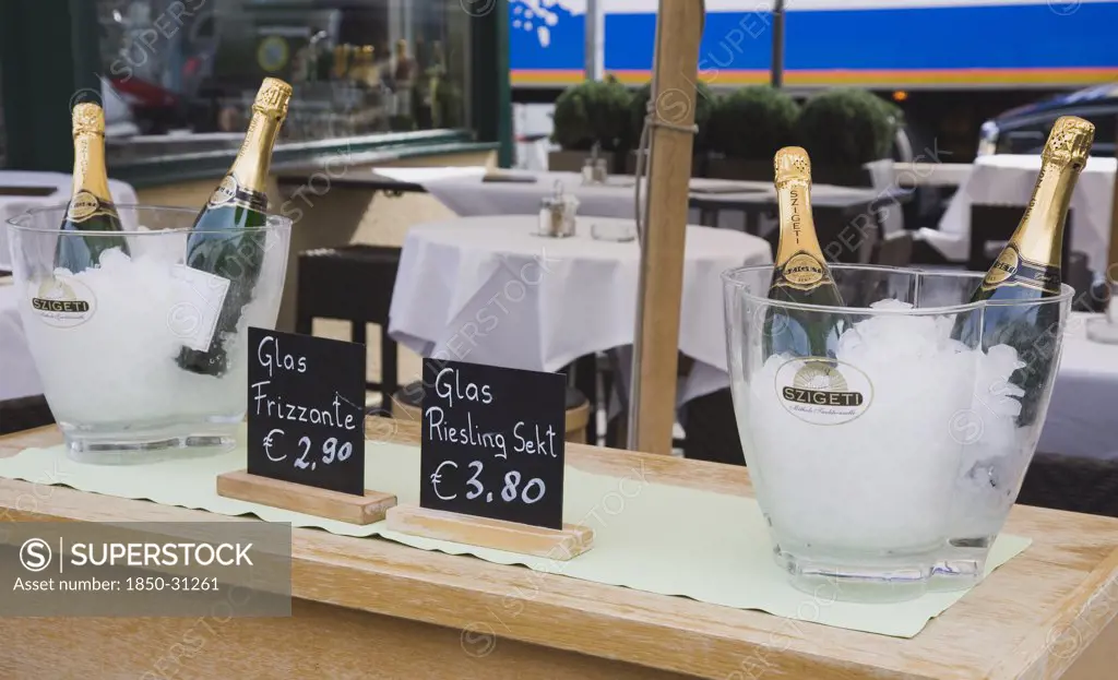 Austria Vienna, The Naschmarkt  Ice buckets with bottles of sparkling Riesling