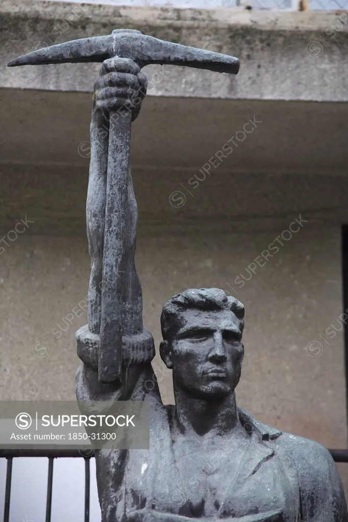 Albania Tirana, Statue of communist worker holding pickaxe