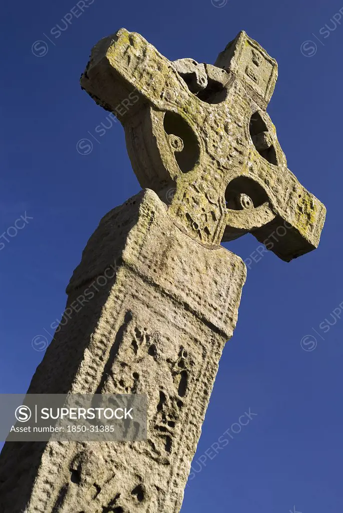 Ireland County Monaghan Clones, Celtic Cross against blue sky