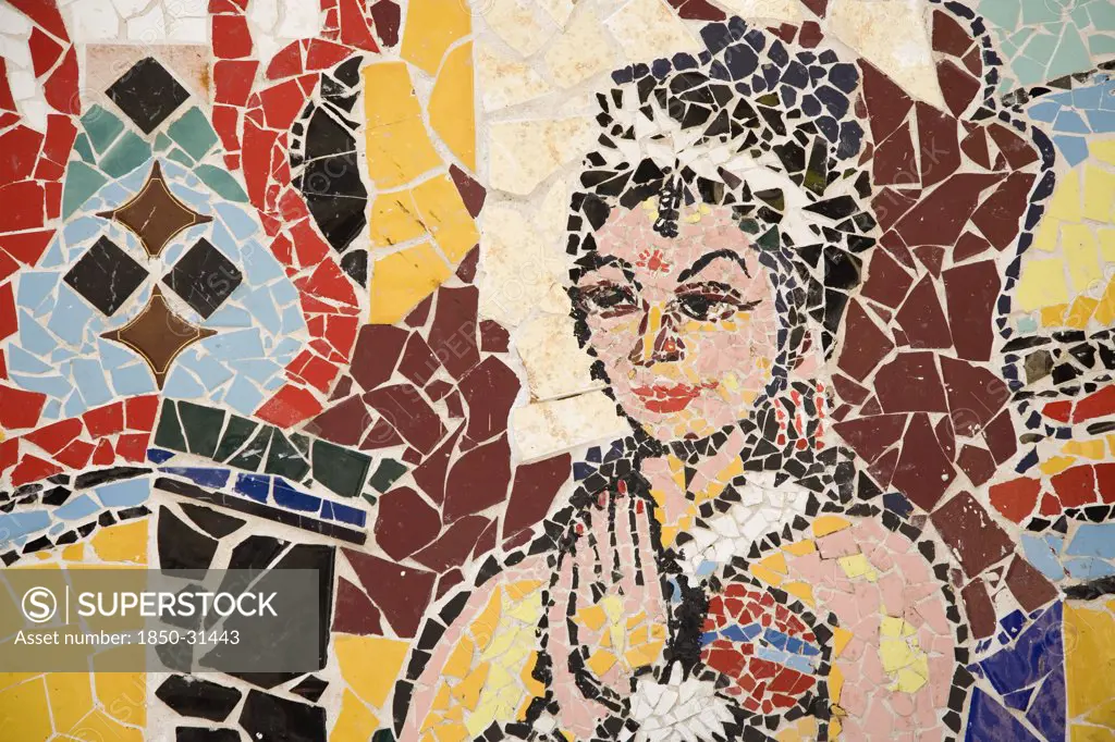 Greece Attica Athens, Mosaic of coloured tile pieces depicting female figure at city subway station