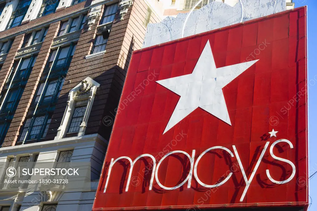 USA, New York, New York City, Manhattan  Red sign for Macys department store with cars on 34th Street and Broadway.