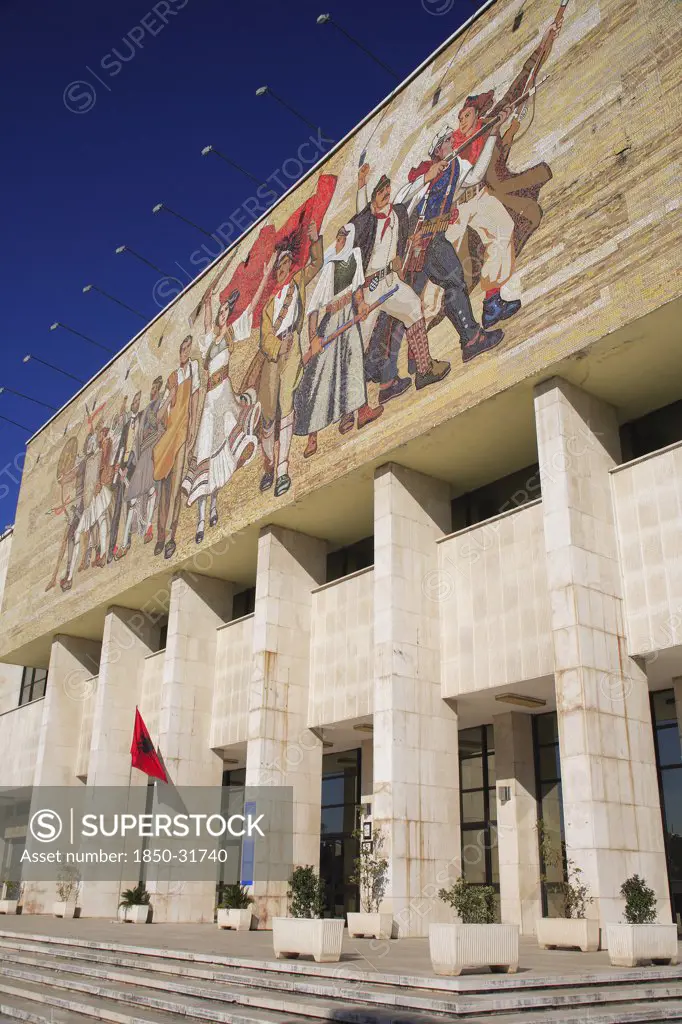 Albania, Tirane, Tirana, National History Museum. Mosaic on the exterior facade of the National History Museum in Skanderbeg Square with steps to entrance below.