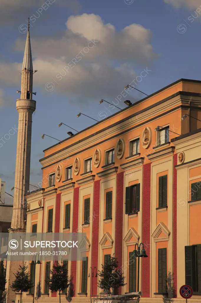 Albania, Tirane, Tirana, Government building facades and minaret of Ethem Bey Mosque in Skanderbeg Sqaure.