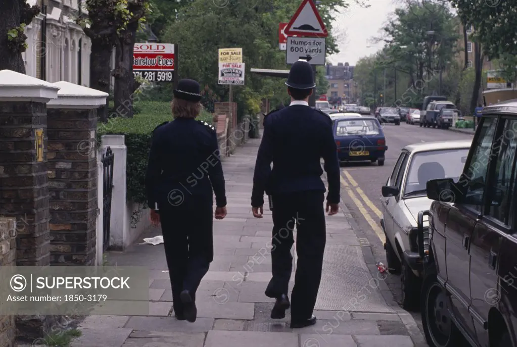 Law & Order ,  , Police, 'Policeman And Woman On The Beat, Walking Along City Pavement.'