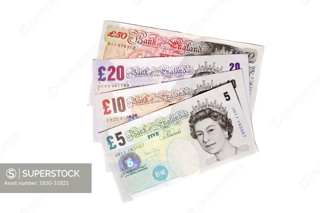 Business, Finance, Money, English sterling currency. Five  ten  twenty and fifty pound notes fanned out on white background.