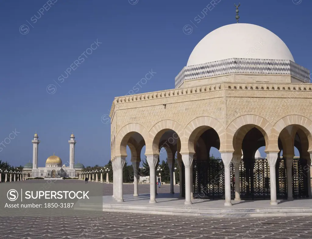 Tunisia, Monastir, Bourguiba Mausoleum In Distance Beyond An Arched Portico With A White Dome