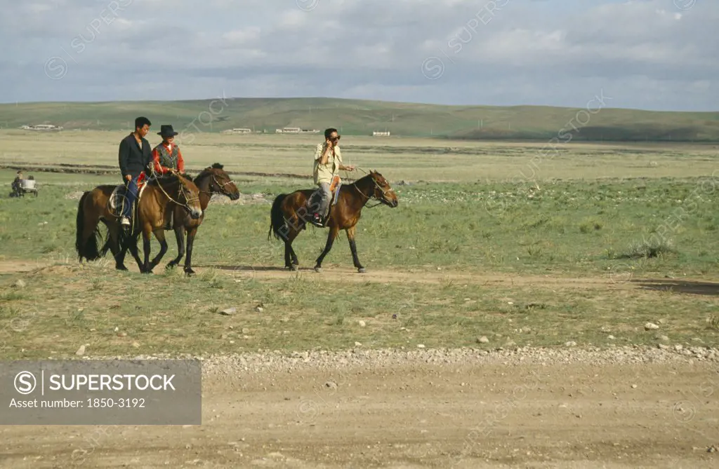 Mongolia, Animals, Horses, Mongol Horsemen Riding Through Open Land