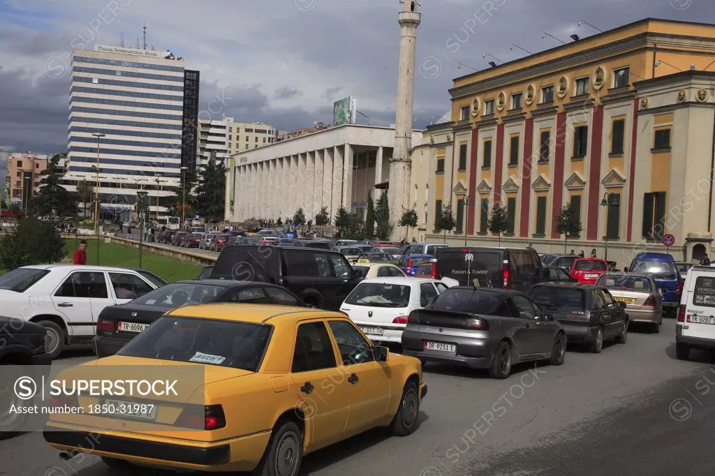 Albania, Tirane, Tirana, Congested traffic in front of the Opera House  Ethem Bey Mosque and government buildings on Skanderbeg Square.