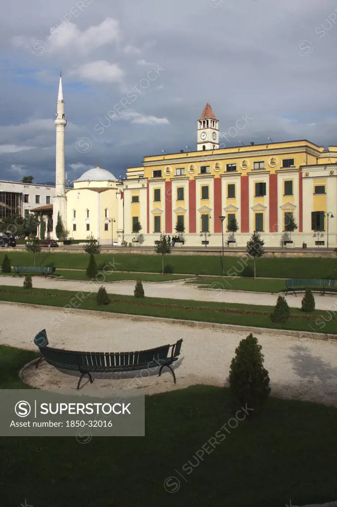 Albania, Tirane, Tirana, Government Buildings and Ethem Bey Mosque on Skanderbeg Square with formal gardens in foreground.