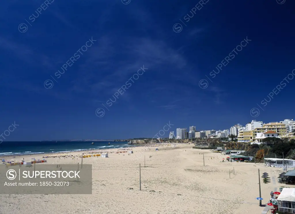 Portugal, Algarve, Praia da Rocha, View along beach with clifftop hotels