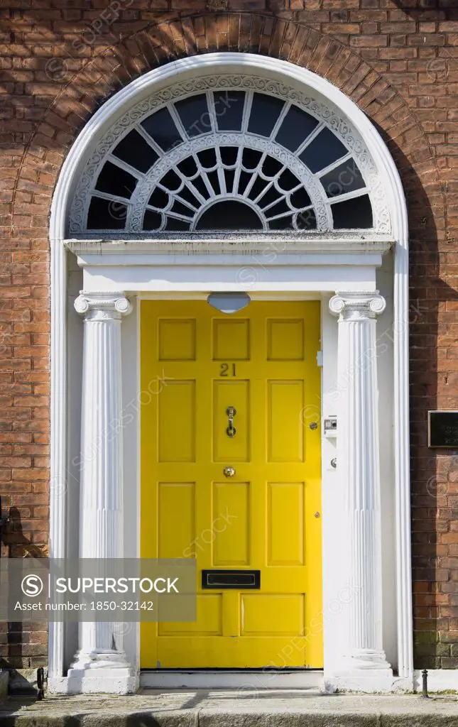 Ireland, County Dublin, Dublin City, Yellow Georgian door in the city centre south of the Liffey River.