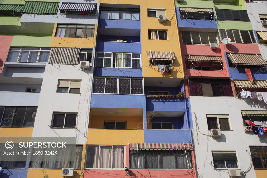 Albania, Tirane, Tirana, Multi coloured exterior facade of apartment block.
