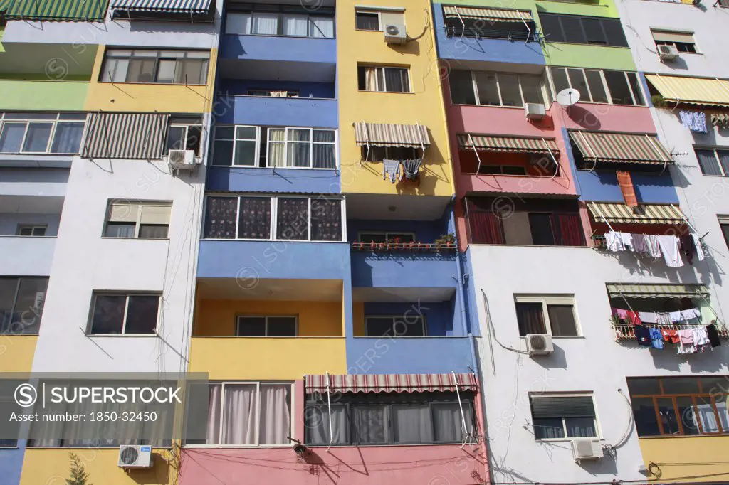 Albania, Tirane, Tirana, Part view of multi coloured apartment block exterior facade.
