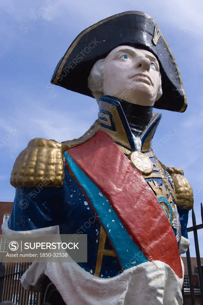 ENGLAND, Hampshire, Portsmouth, Ship's figurehead of Admiral Lord Nelson in the Historic Naval Dockyard.
